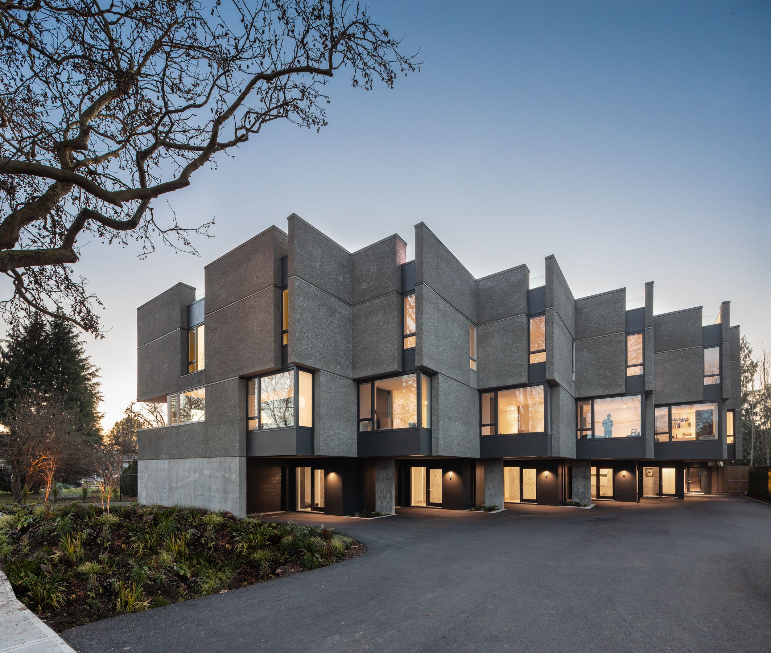 Exterior of Aryze's Pearl Block townhome development in evening light